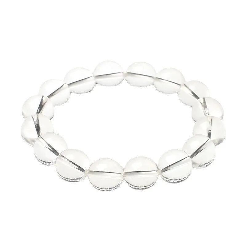 Natural white crystal bracelet with round beads, showing unisex geometry design on a wrist.