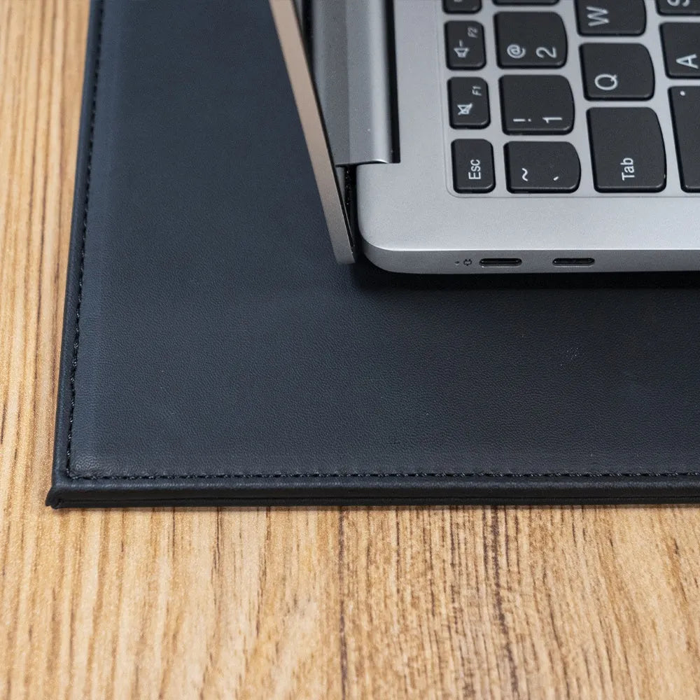 Anti-radiation printing tablet pad in black, gold, blue, and green colour options on a desk.