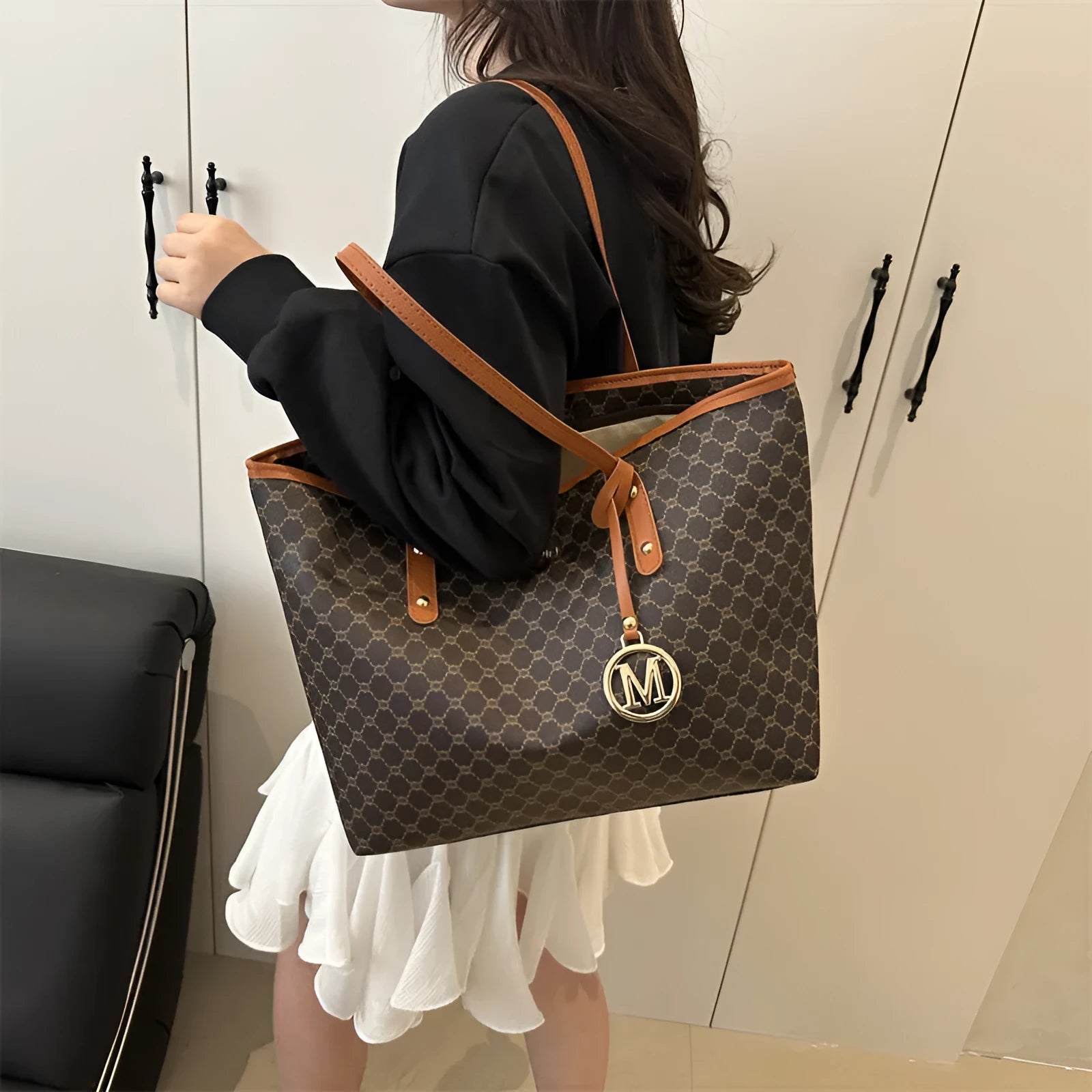 Women's western style PU leather shoulder bag in black showing visible sewing thread details.