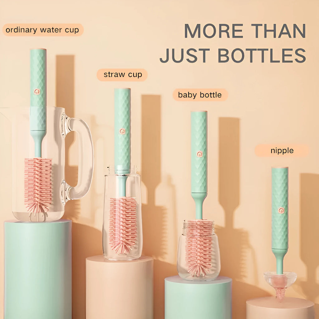 Pink and green electric baby bottle brush with rotating silicone head and USB charging cable