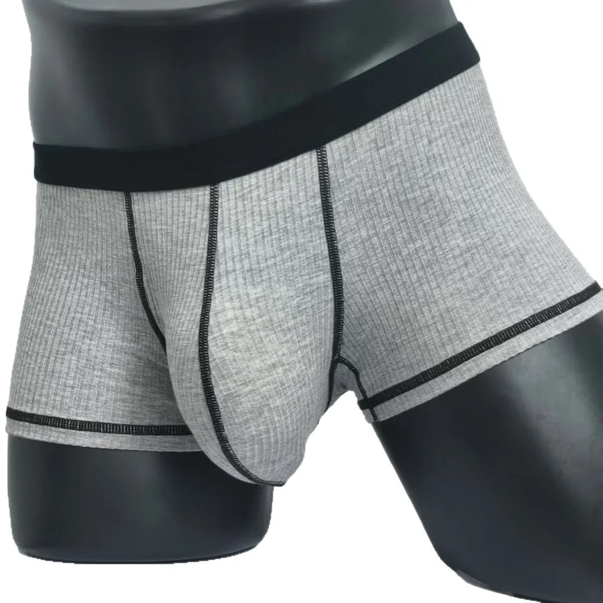 Men's solid colour boxer shorts in thin fabric, shown in army green, highlighting breathable and body-shaping design.