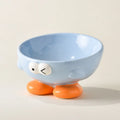 Blue slanted ceramic pet bowl with cute expression design for cat and dog cervical spine support