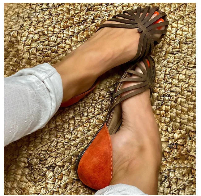 Leopard print women's flat heel sandals with a square buckle and adjustable ankle strap.