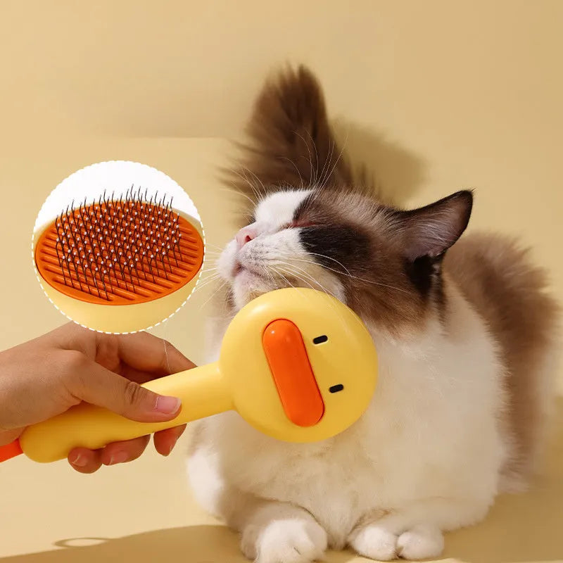 Small yellow duck-shaped pet grooming comb with open sections for cats and dogs