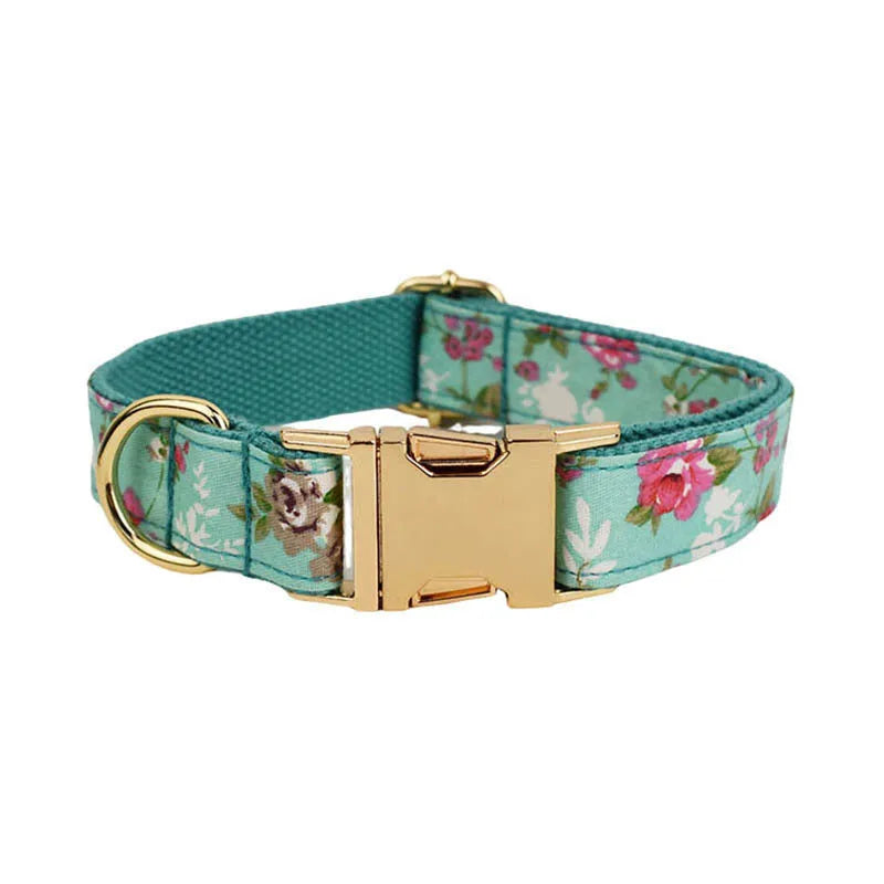 Rose-coloured fabric dog collar set with green background, includes leash, detachable bow, and vest for dogs.