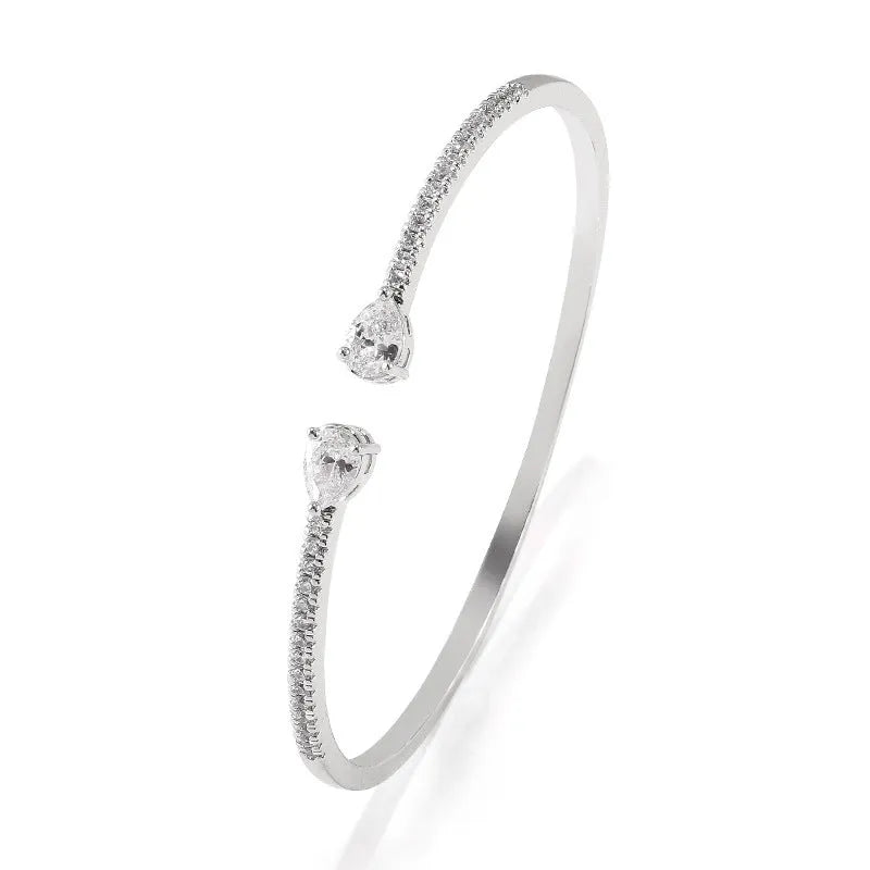 Multi-zircon fashion bracelet crafted from copper with zircon inlaid treatment in white or blue colour