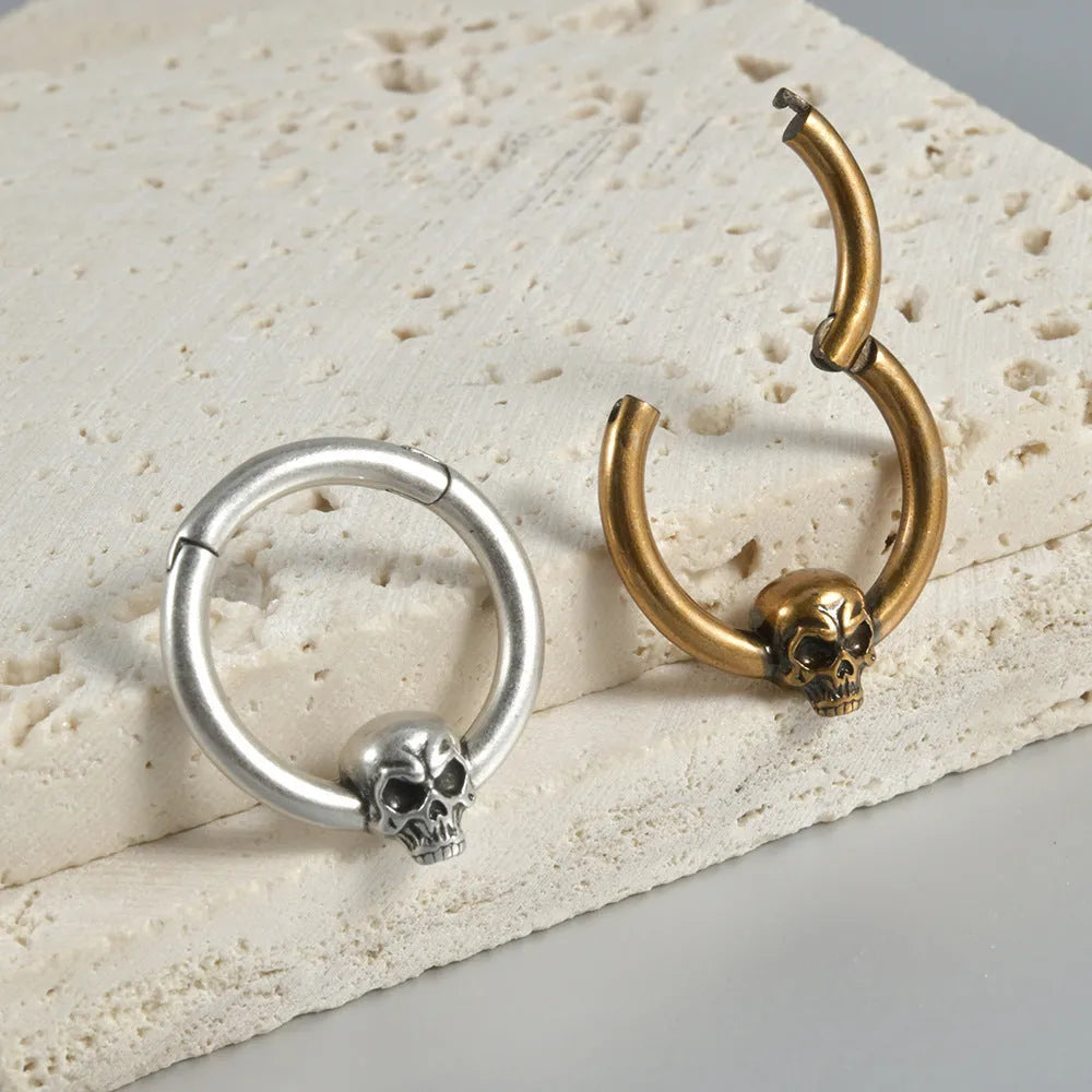 Copper punk earrings with ghost head design in antique gold or silver finish.