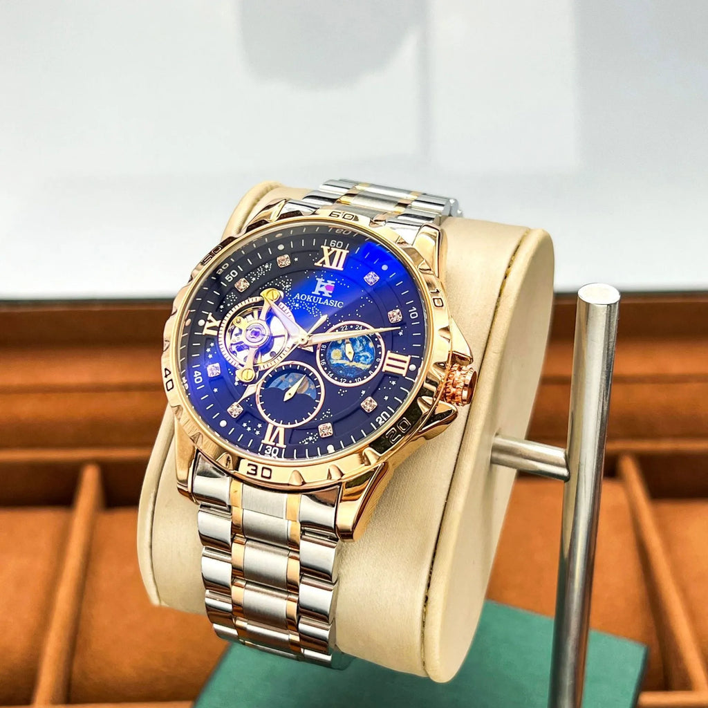 Automatic mechanical men's watch with rose gold case and black dial on wrist.