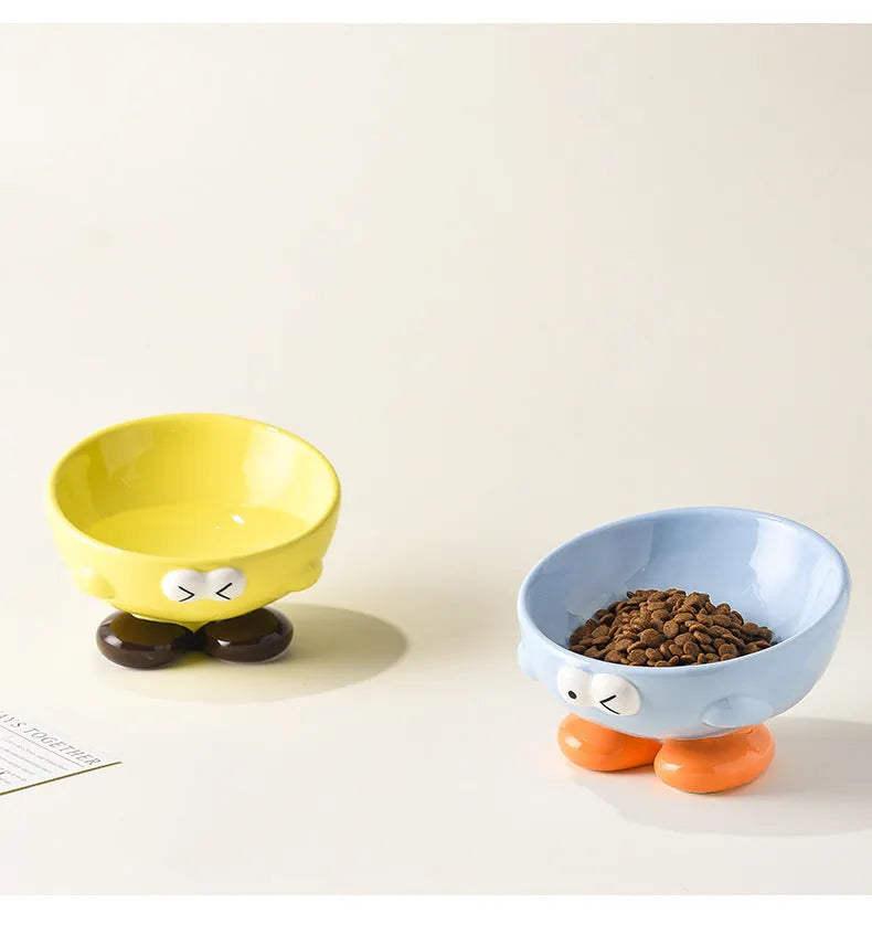 Blue slanted ceramic pet bowl with cute expression design for cat and dog cervical spine support