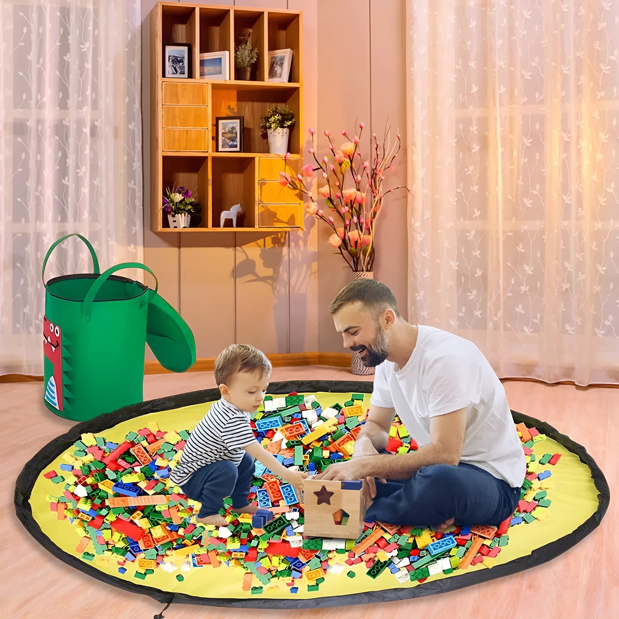 Green felt cube storage bag with pull rope, shown both as a flat play mat and gathered toy bag