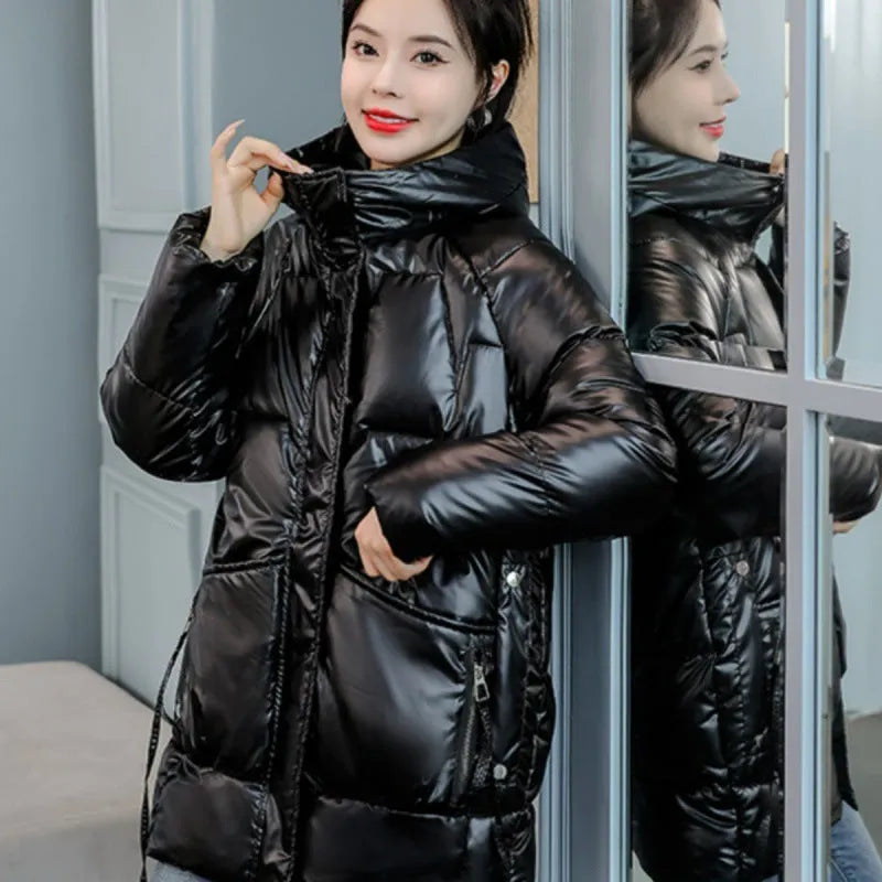Women's loose-fit hooded winter jacket in blue with thick cotton filling.