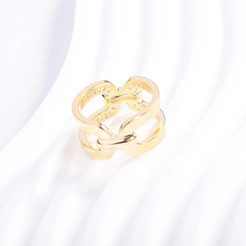 Round copper scarf ring with gold electroplated finish and geometric shape for securing scarves