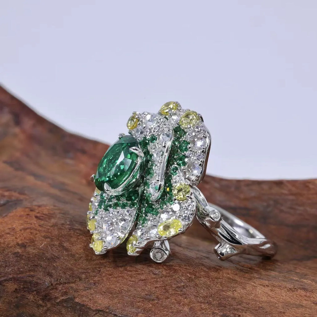 Secret Garden Series gradient emerald ring on a plain background showing the stone colour