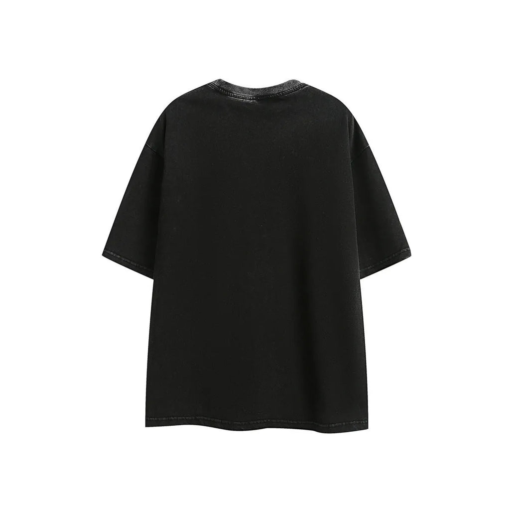 Man's loose fit black retro washed cotton short-sleeved t-shirt on a hanger.