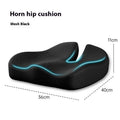 Black memory foam office chair cushion for waist support, shown on a desk chair.