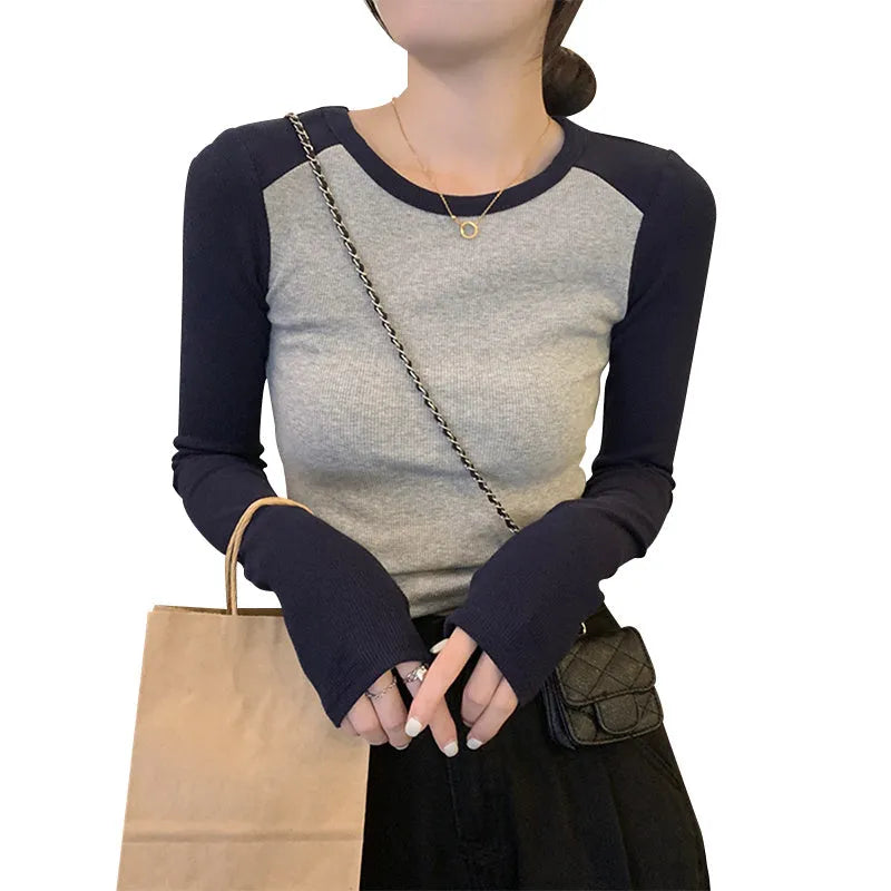 Women's dark blue slim-fit viscose top with long princess sleeves and embroidery detail on the front.