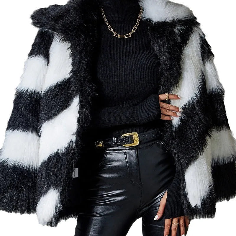 Women's faux fur coat with contrast colour lapel and matching fur collar on a model.