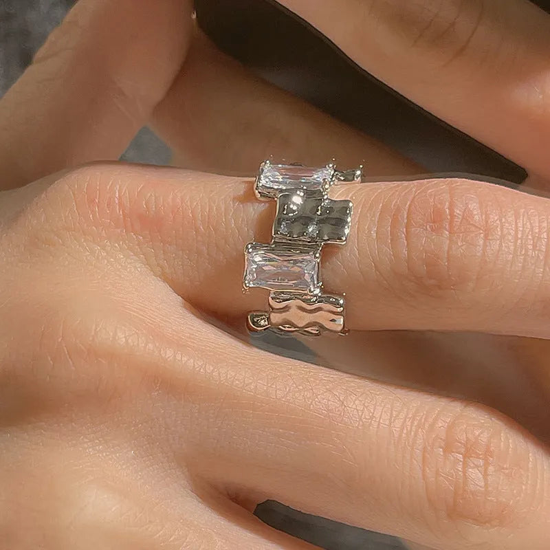 Silver geometric open ring with zircon stone setting and three-dimensional decoration