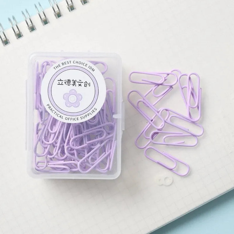 Set of macaron colour alloy paper clips in pink, green, and purple, showing 28mm and 50mm sizes, on a light background