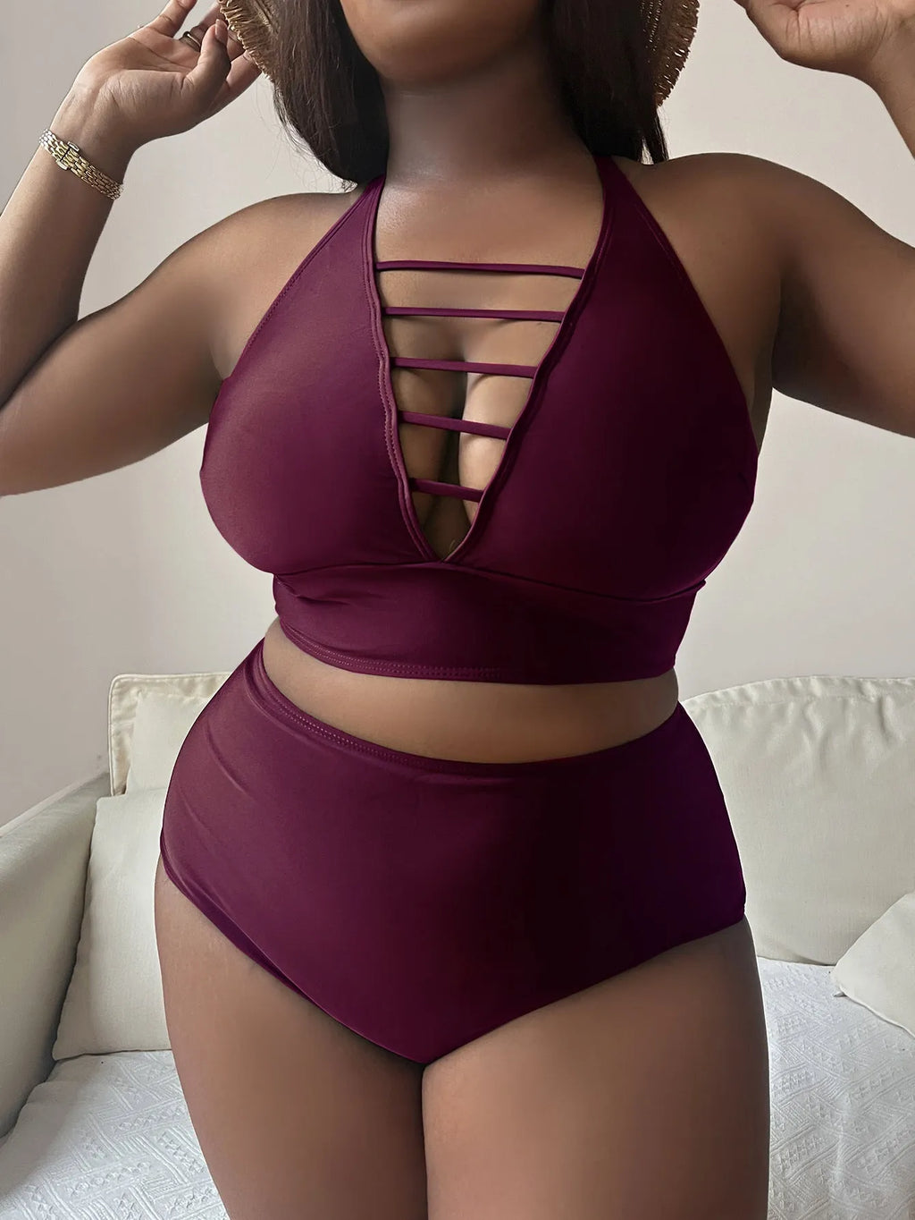 Plus size black halter bikini with adjustable straps and high-waist briefs on a mannequin.