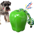 Green and red plastic apple-shaped dog chew toy with squeaker.