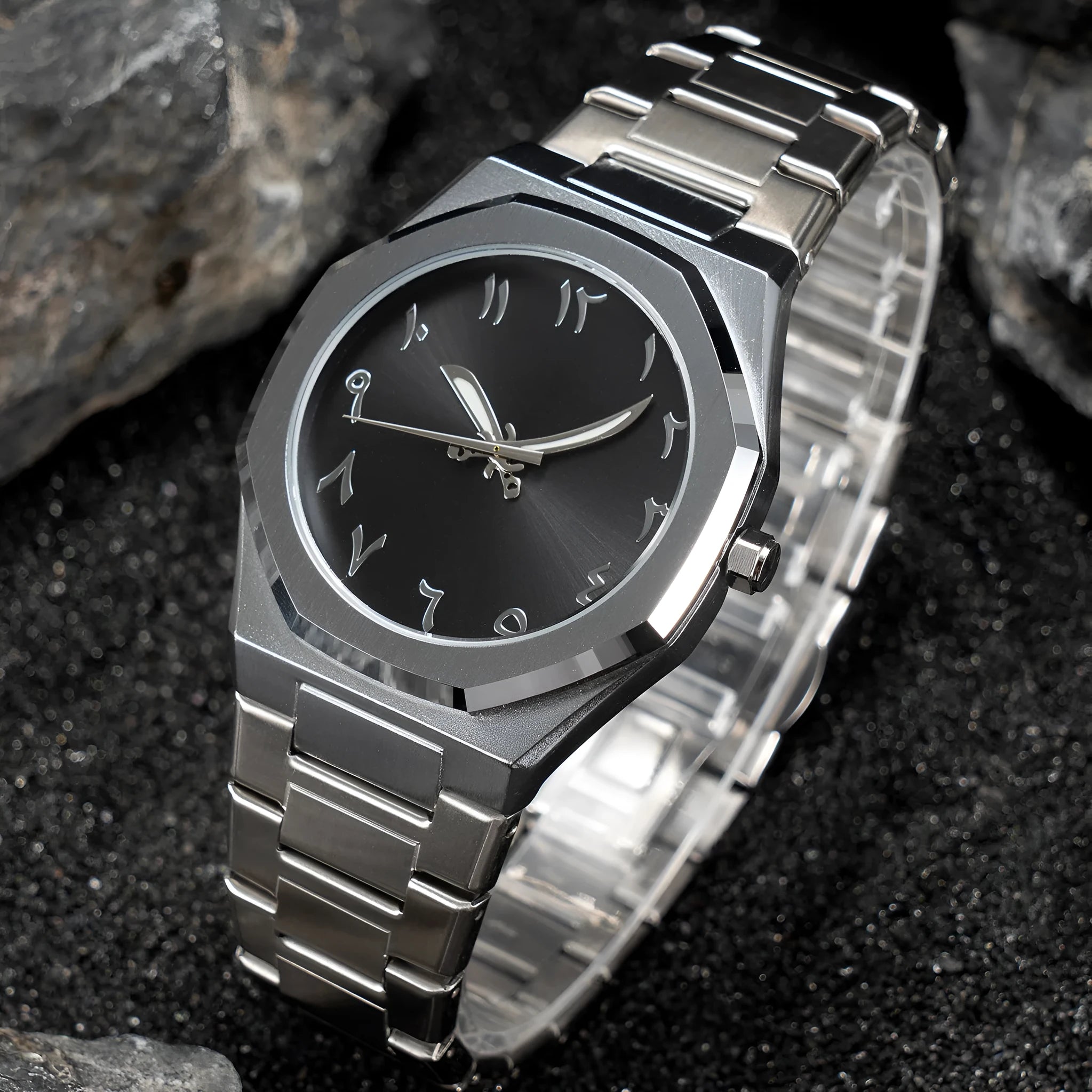 Men's silver and black business casual watch with steel bracelet and analogue dial on a wrist.