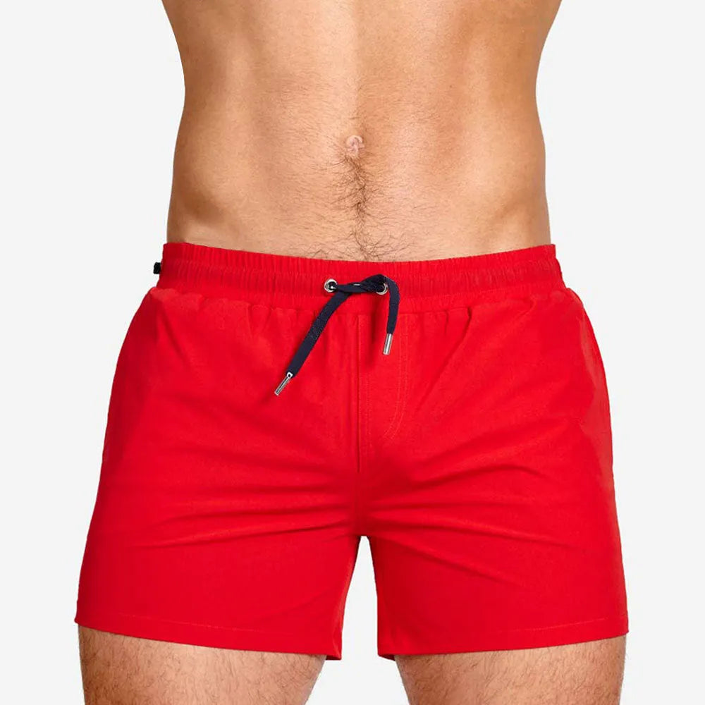 Pair of solid colour sports shorts with mesh lining for swimming and fitness training.