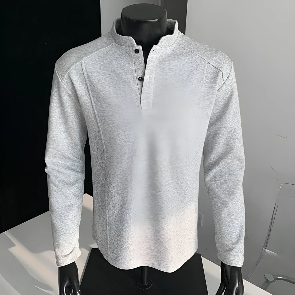 Men's loose-fitting asymmetric patchwork polo shirt with a stand-up collar and long sleeves in grey.