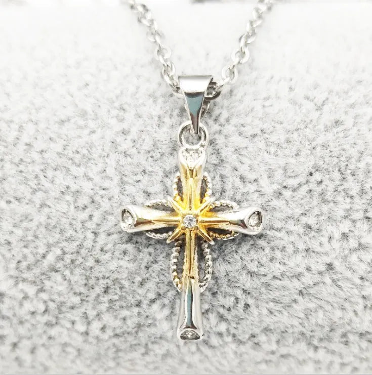 Silver alloy cross pendant with octagonal star detail on ring chain, 22x15mm size