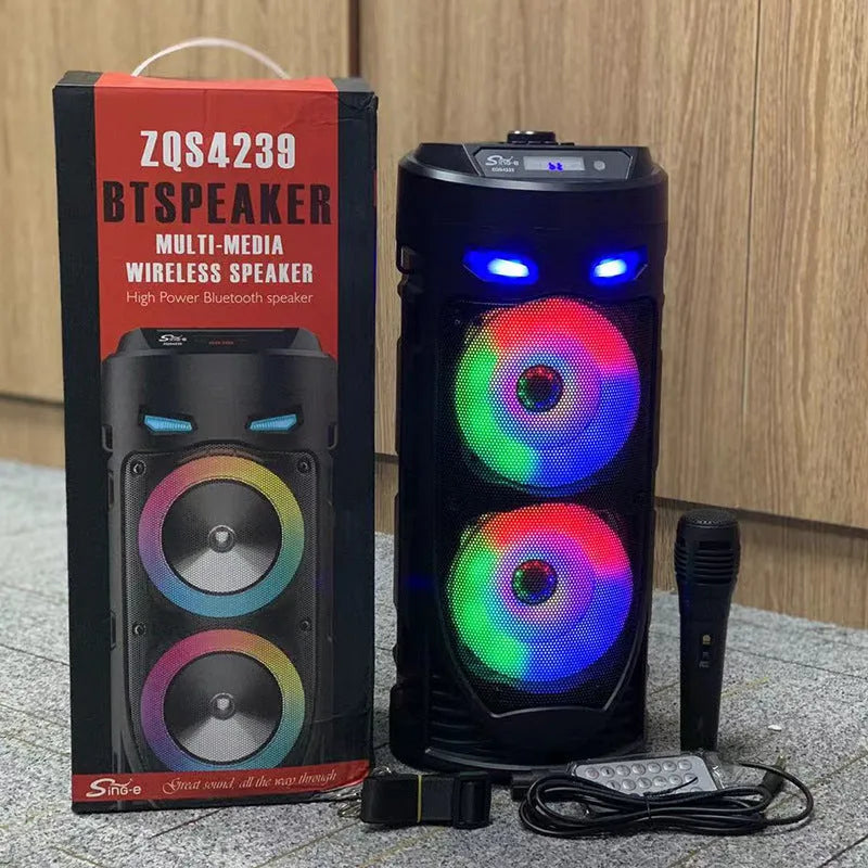 Black portable Bluetooth speaker with dual horn design and wheat detailing, showing USB port and card slot