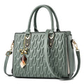 Women's large black PU shoulder messenger bag with front pocket and shoulder strap.