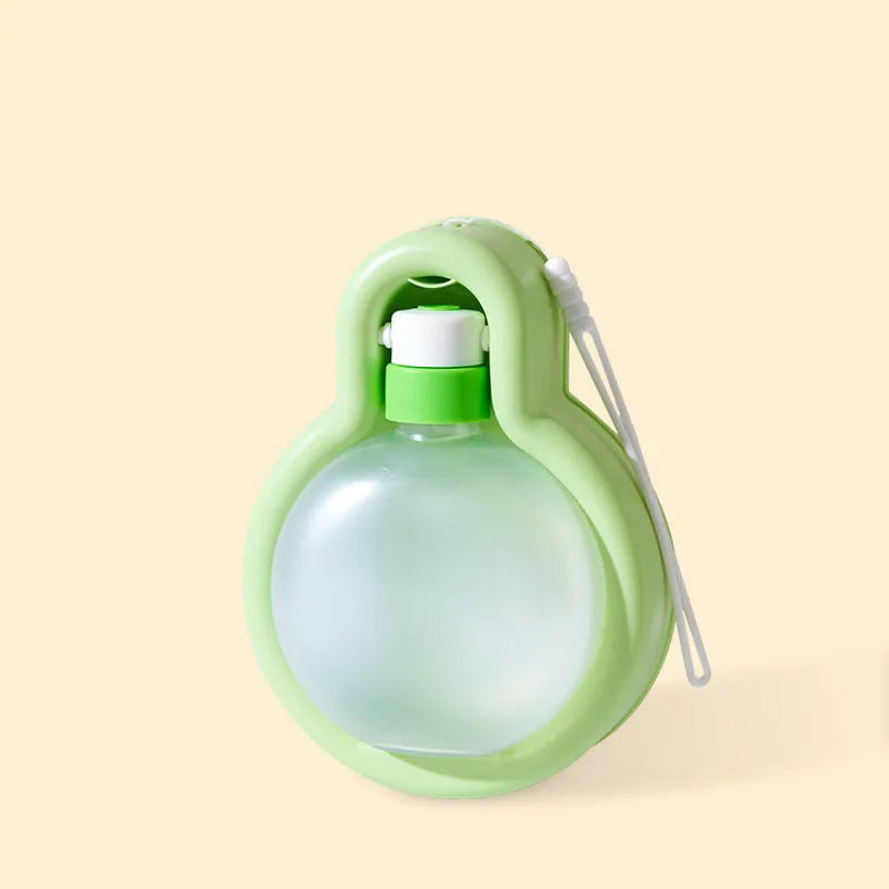 Green dog travel water bottle with integrated pull-out bowl and handle