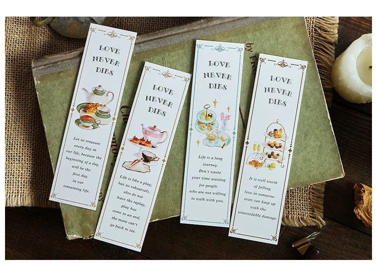 Pack of 30 white cardboard art bookmarks with designs including flowers and patterns, next to their plastic carton.