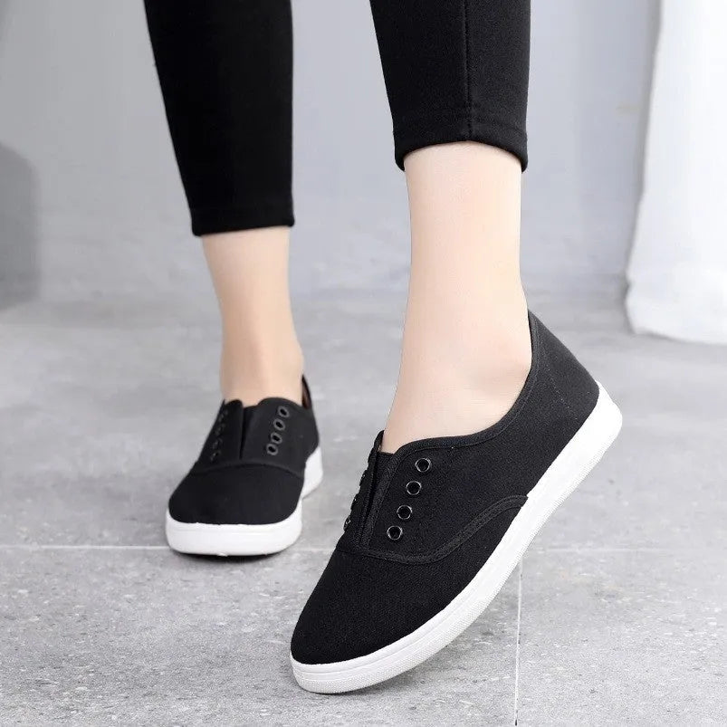 A pair of low-top canvas casual shoes in a choice of colours, featuring a flat heel and cloth lining.