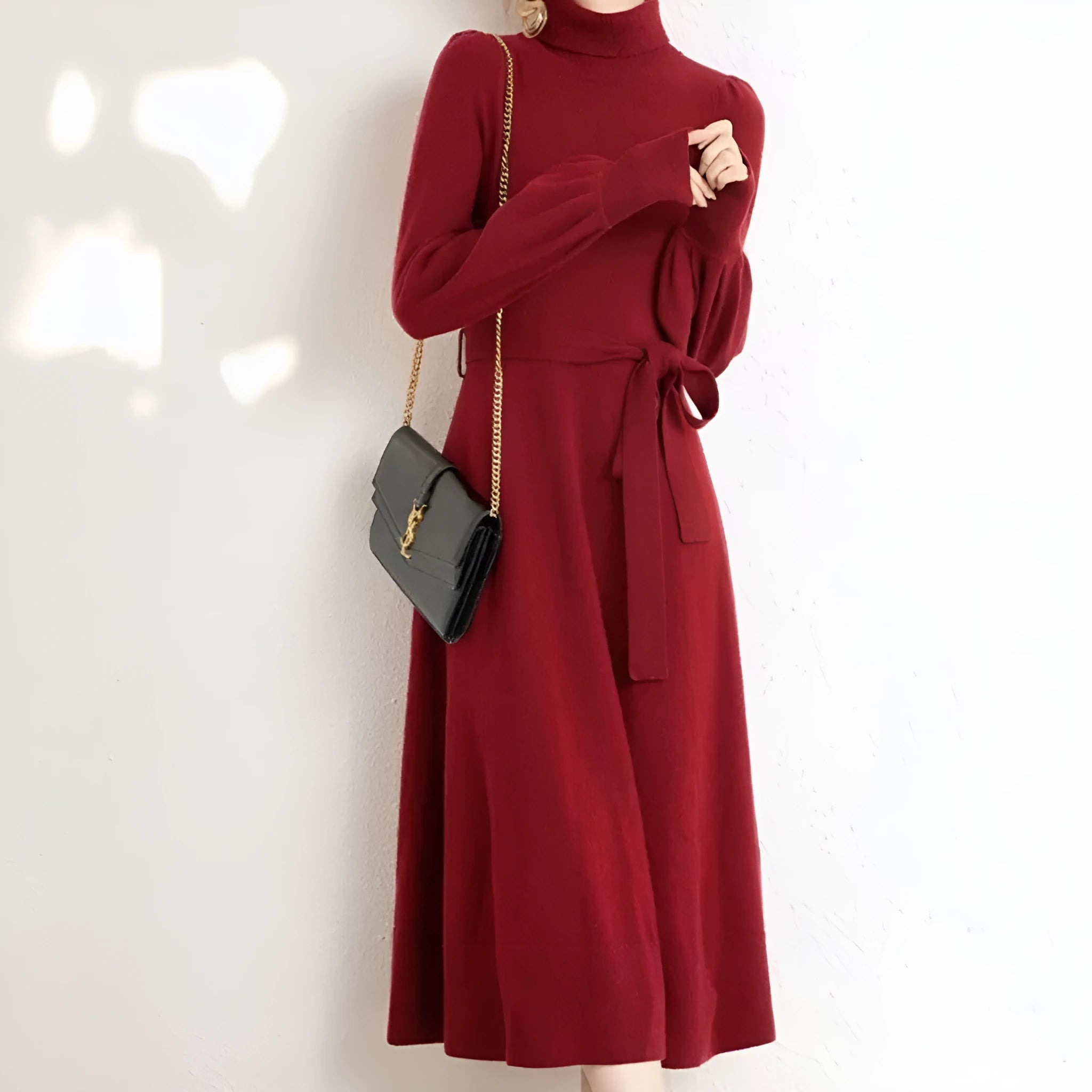 Rose red turtleneck knit dress with long sleeves, elastic waist, and a flared midi-length skirt.