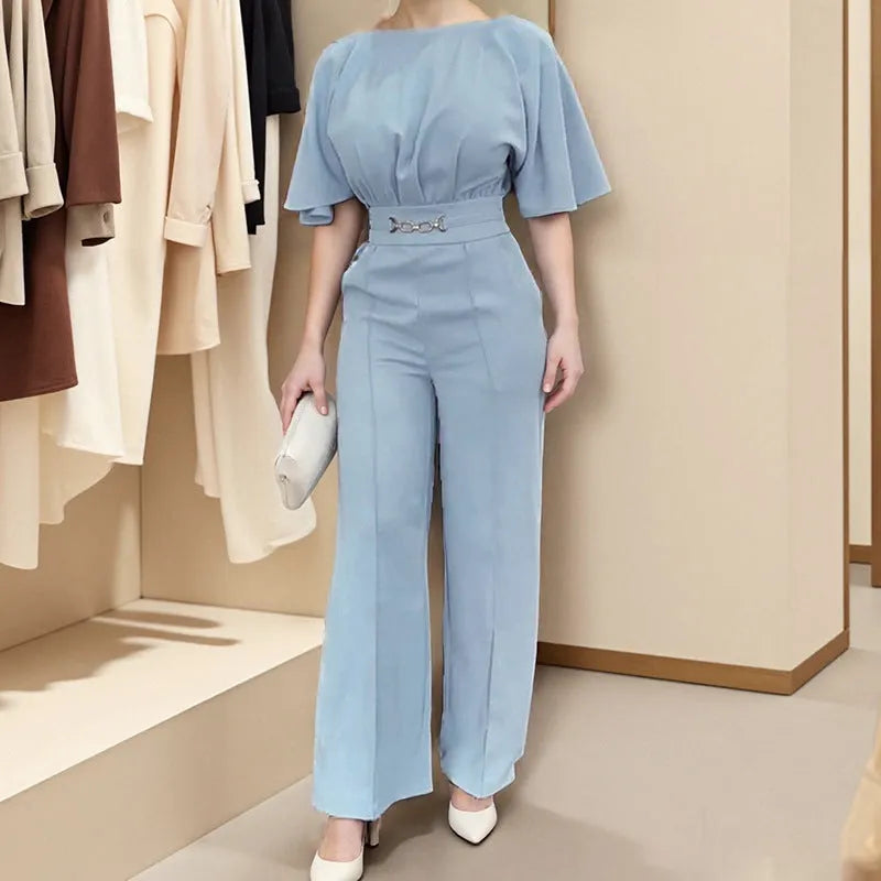 Blue two-piece polyester men's suit with long-sleeve jacket and trousers on a hanger.