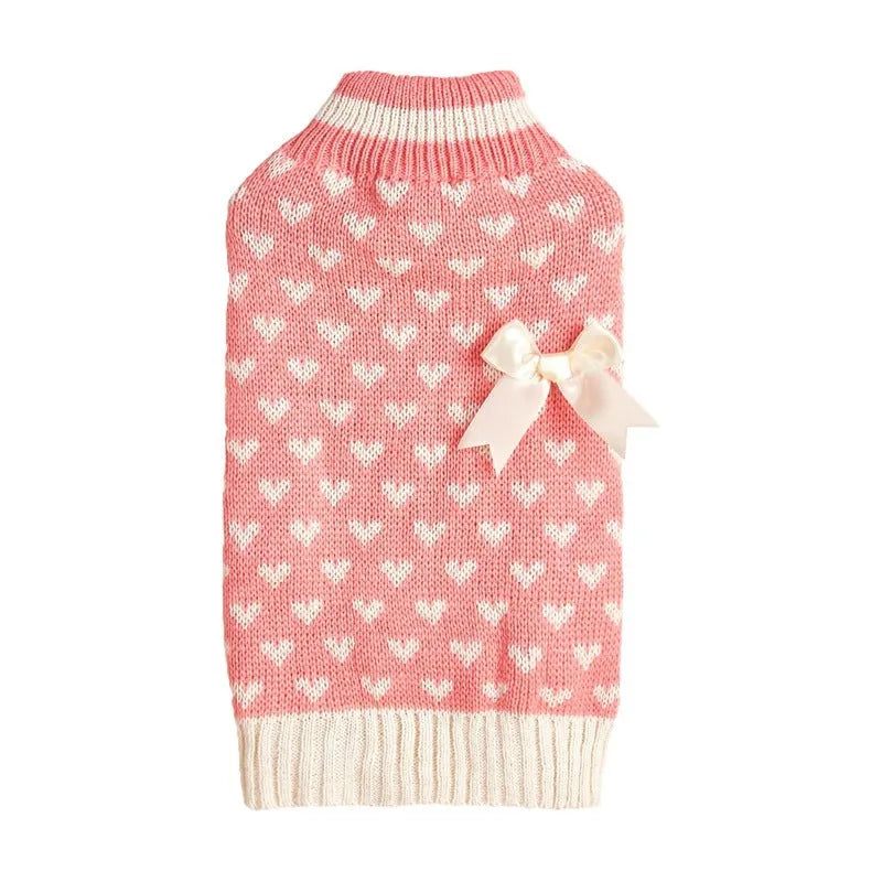 Red love heart design dog sweater on small dog showing acrylic knit and decorative motifs
