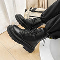 Men's black platform Doc Martens boots with side zipper, frosted cowhide leather upper, and rubber sole.