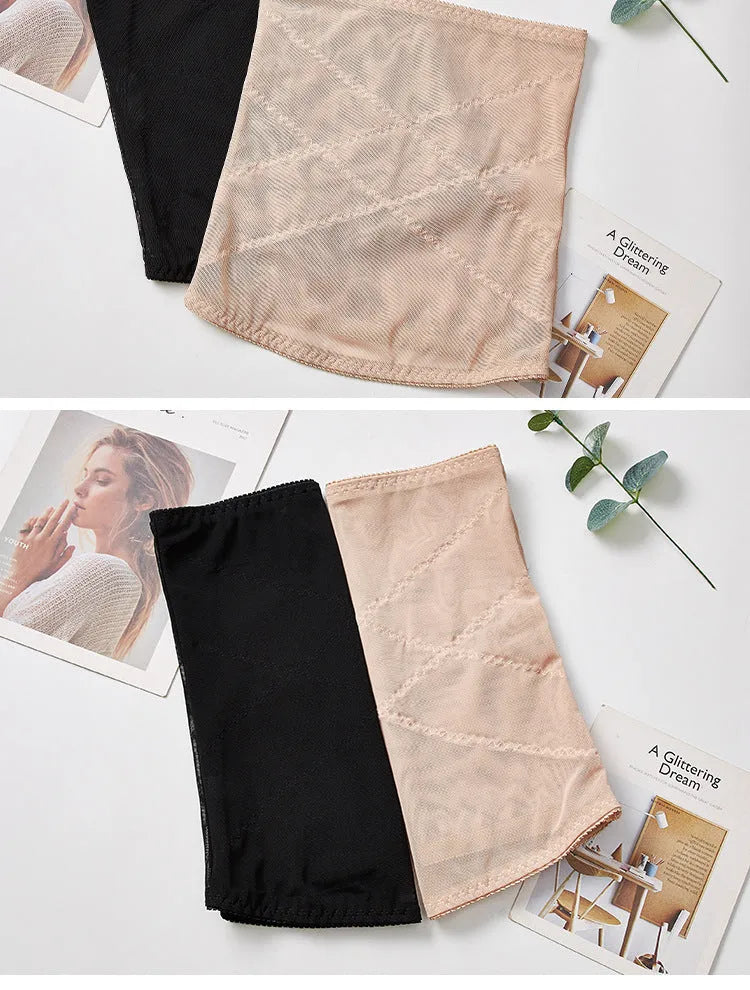 Thin black mesh belly band for waist trimming and postpartum tummy support laid flat.