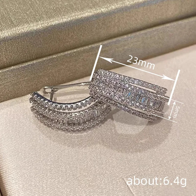 Geometric copper stud earrings with white gold finish and zircon stone decoration