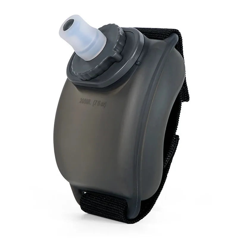 Orange wrist water bottle with Velcro strap showing 200ml capacity and bite valve mouthpiece