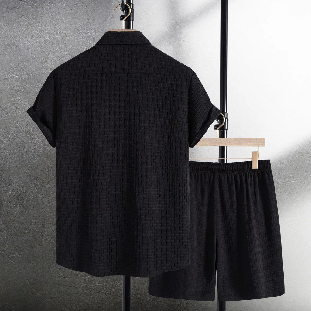 Men's casual cotton blend beach shorts suit in black, showing short sleeve shirt and matching shorts.