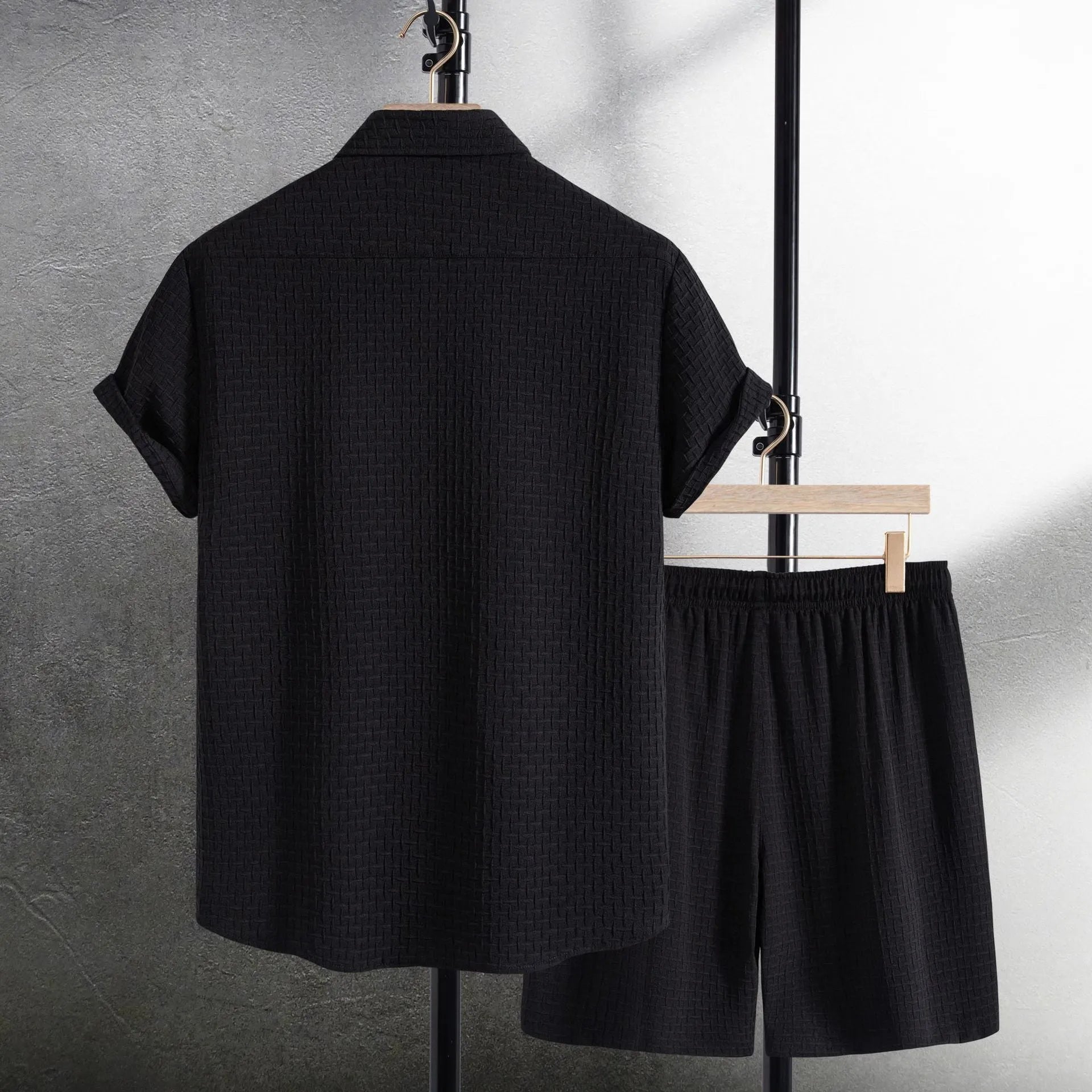 Men's casual cotton blend beach shorts suit in black, showing short sleeve shirt and matching shorts.