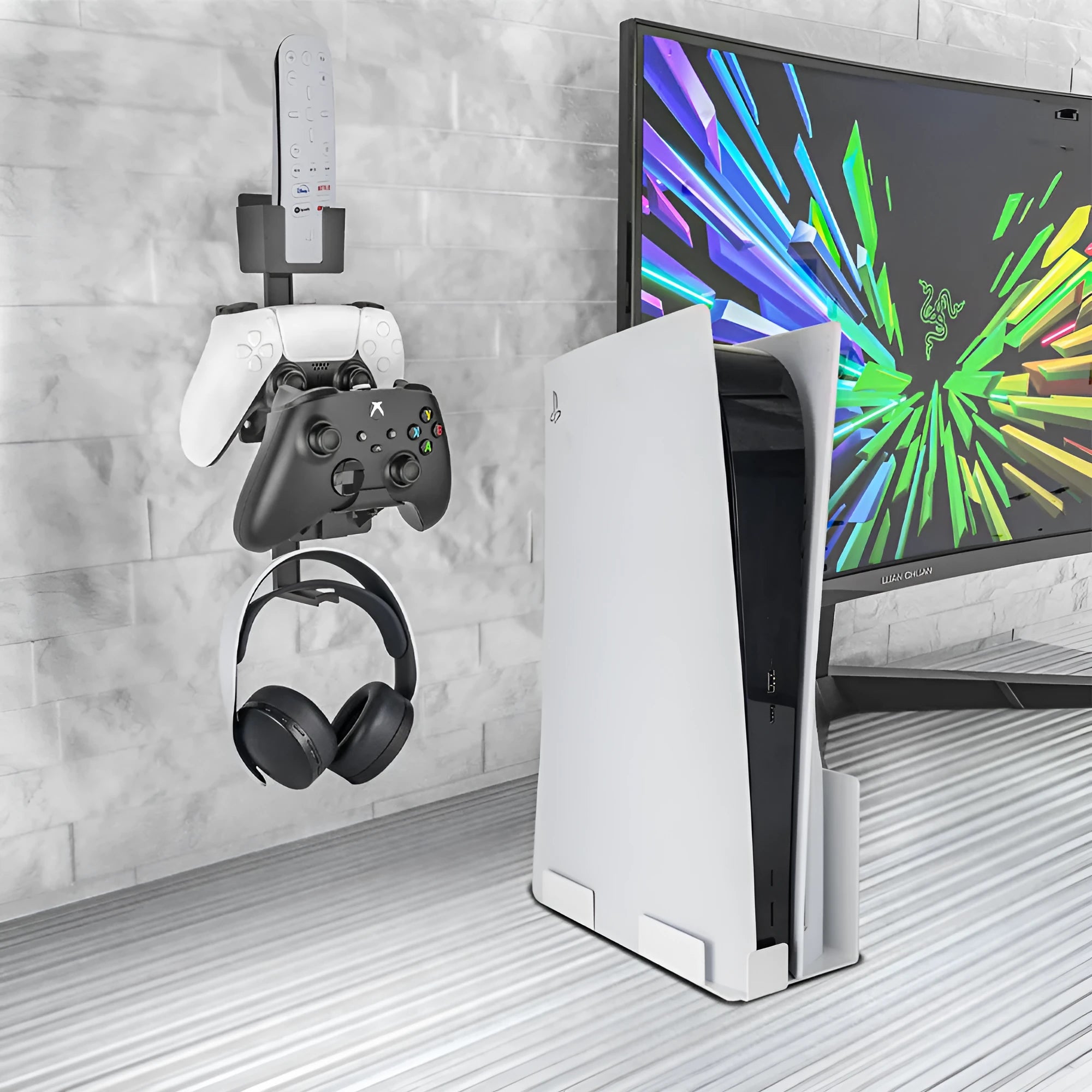 White ABS plastic wall hook holding a PS5 controller and headphones.
