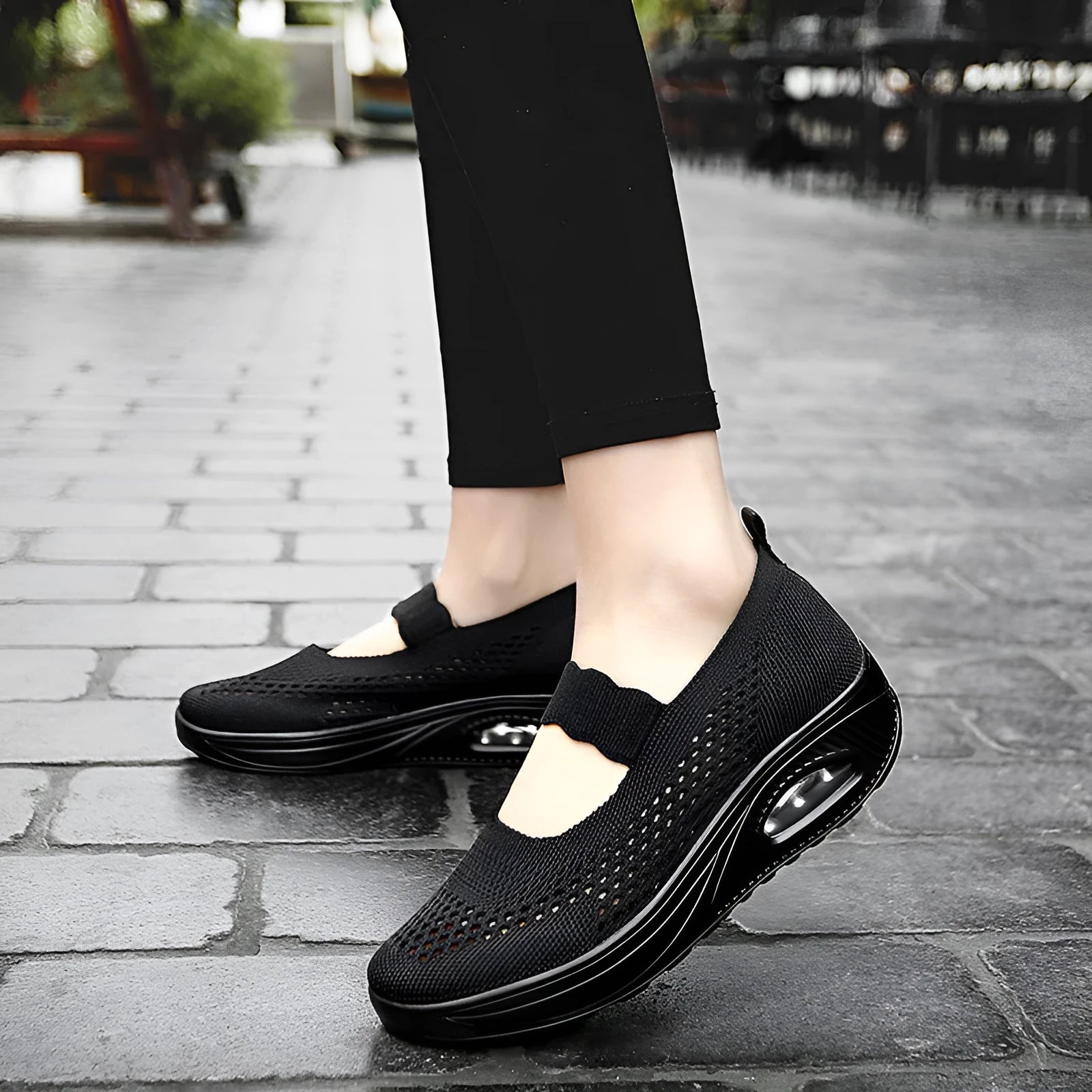Women's black mesh slip-on casual shoes with round toe and low heel