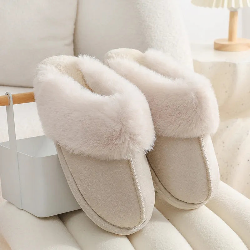 Women's plush winter slippers with artificial wool lining and a PVC sole in multiple colours.