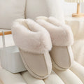 Women's plush winter slippers with artificial wool lining and a PVC sole in multiple colours.