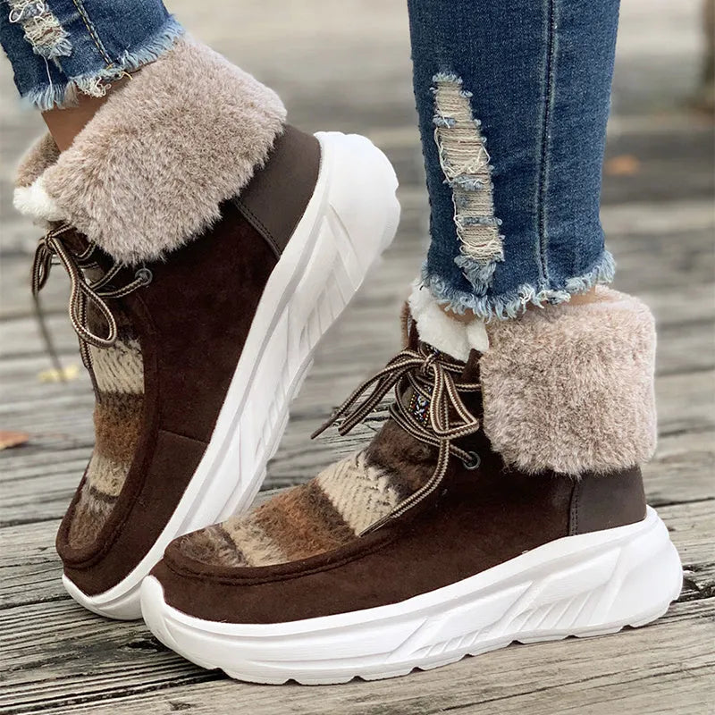 Women's beige suede lace-up snow boots with a thick platform sole and plush lining on a white background.