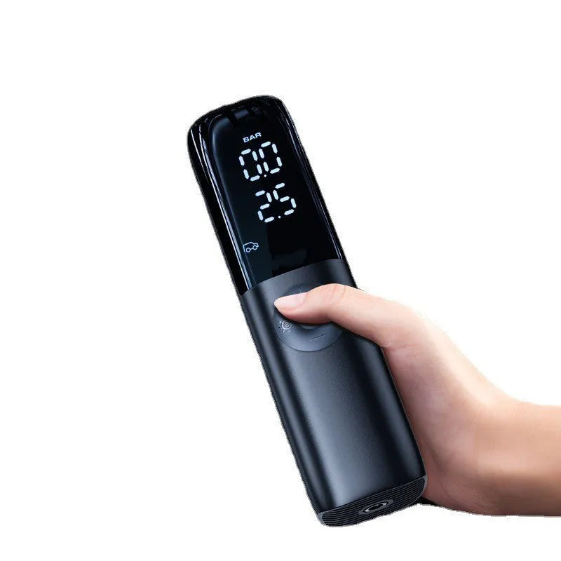 Black portable electric car air pump with tyre pressure gauge and inflation hose.