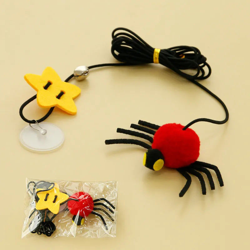 Hanging door cat toy with elastic rope, feather, bell and spider attachments in red or yellow colour